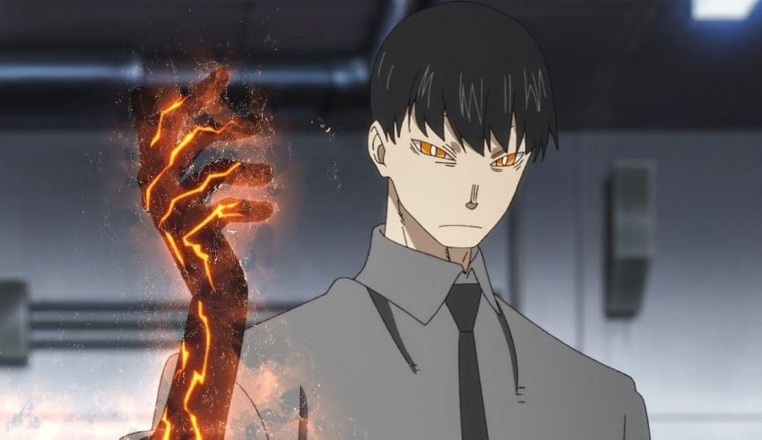 A man in a suit holding a flame in his hand.
