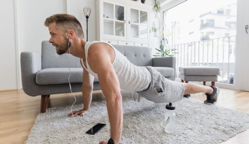 A man doing push ups in his living room.