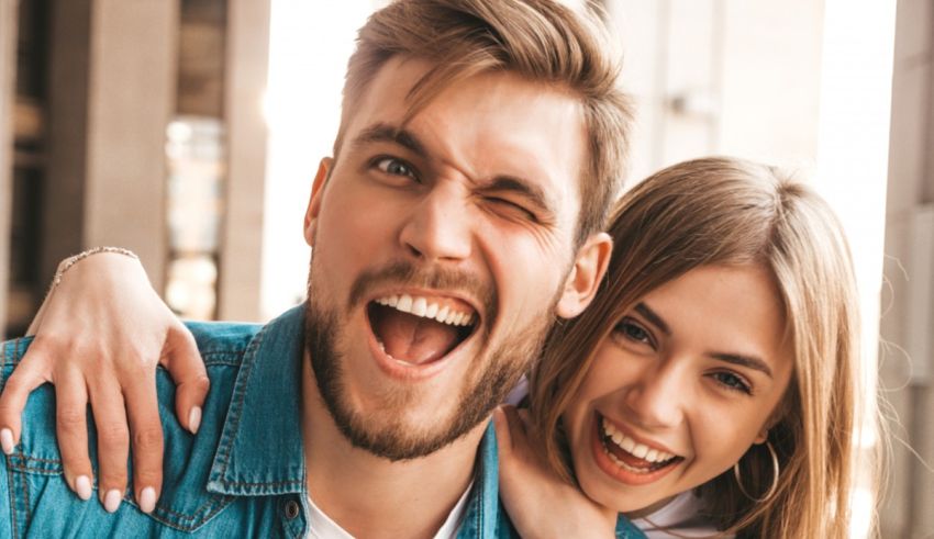 A man and a woman laughing together.