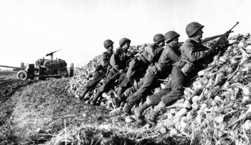 A group of soldiers standing next to a pile of corn.