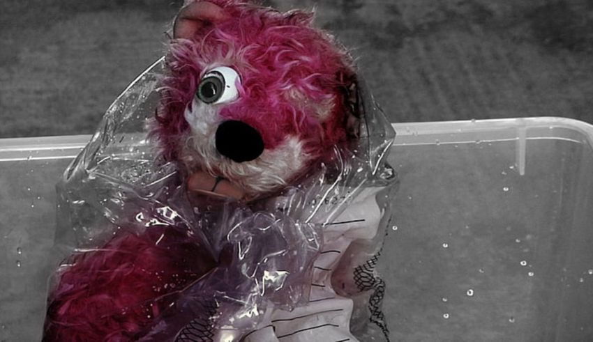 A stuffed animal covered in plastic.