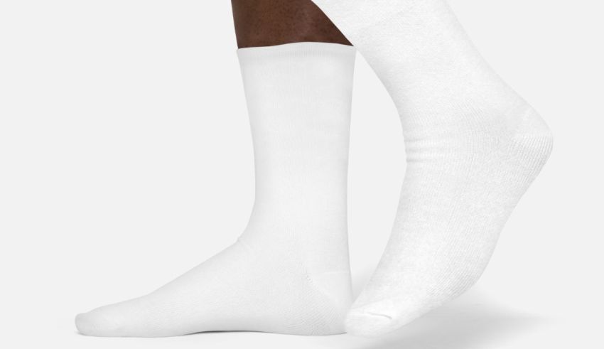 A pair of white socks on a white background.