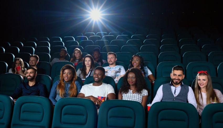 A group of people sitting in a movie theater.
