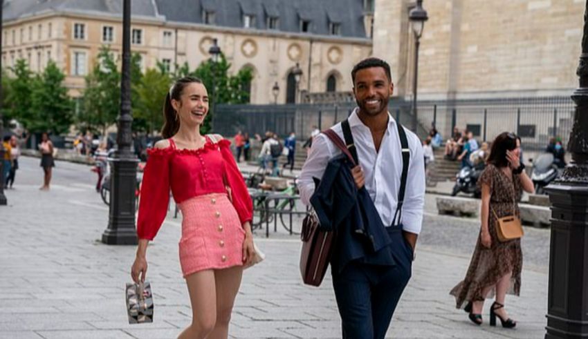 A man and woman walking down a street in paris.