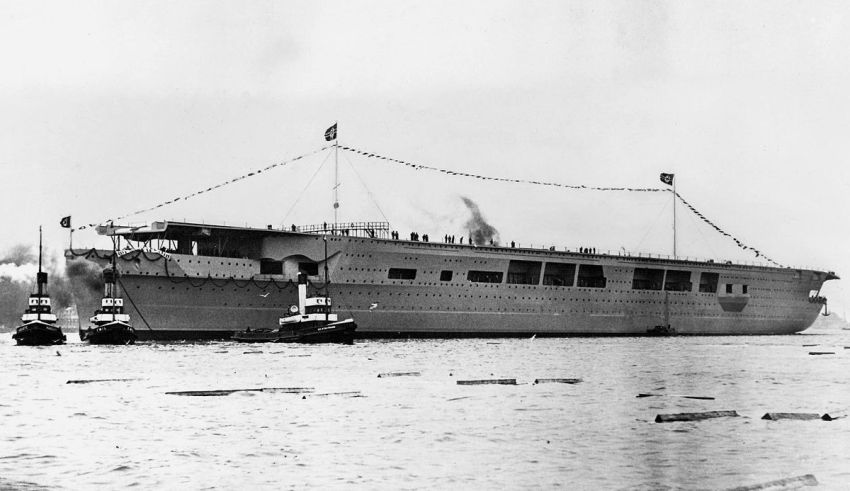 An old photo of a large ship in the water.