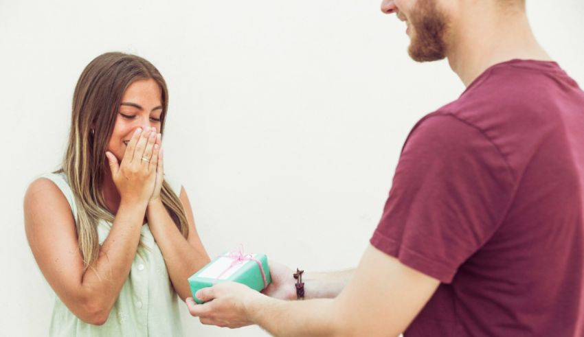 A man giving a gift to a woman.