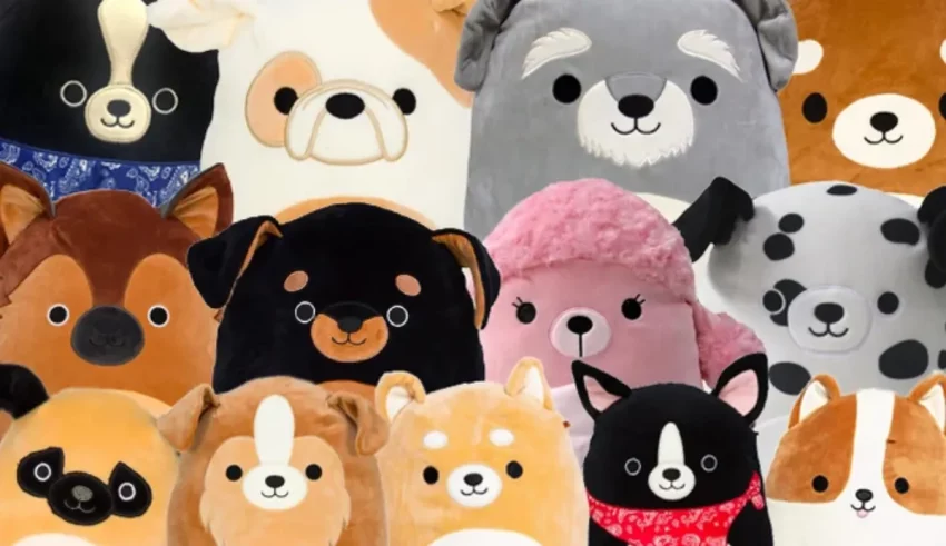 A group of dog stuffed animals are arranged in a row.