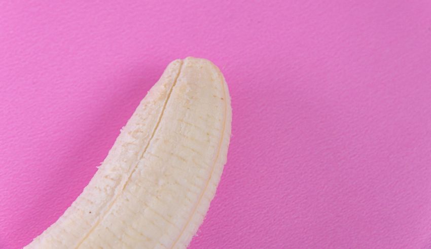 A banana on a pink background.