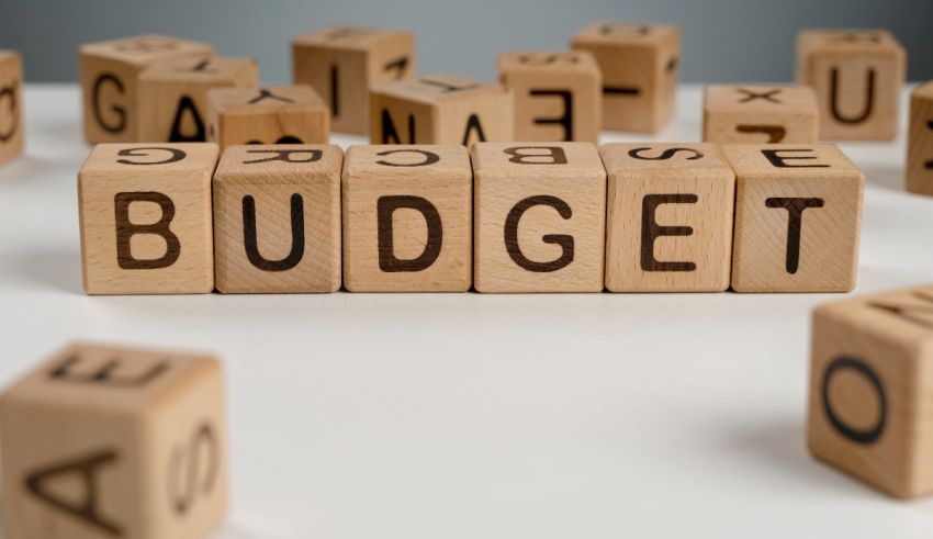 The word budget spelled out in wooden blocks.