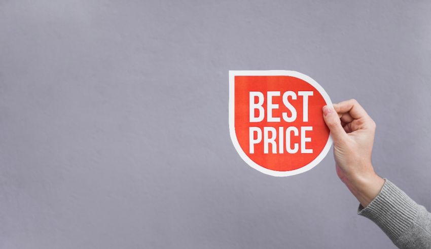 A woman holding up a sticker with the word best price.