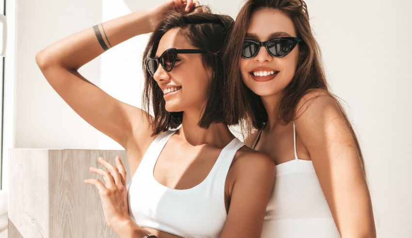 Two women in sunglasses posing for a photo.