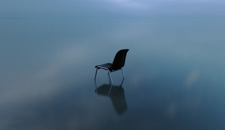 A chair in the middle of the water.
