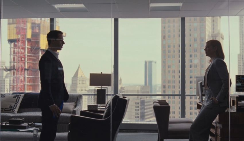A man and a woman standing in an office.