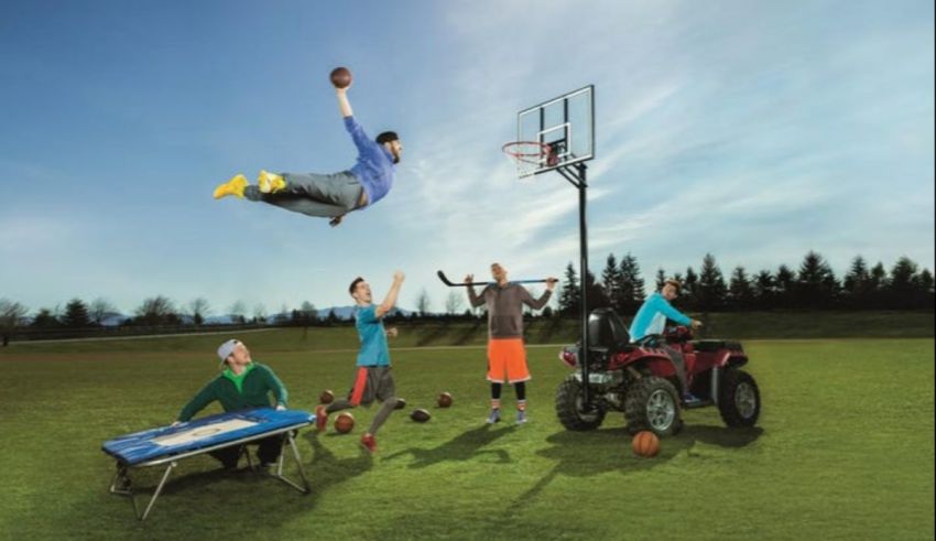 A group of people jumping over a basketball hoop.