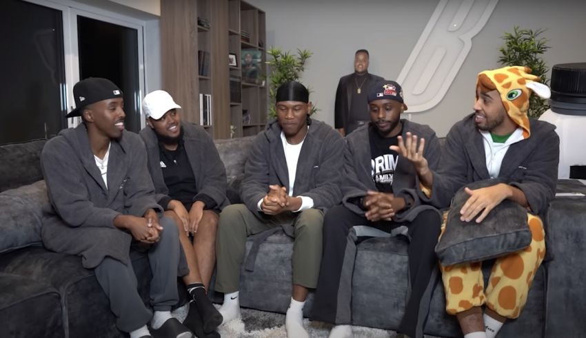 A group of men sitting on a couch in pajamas.