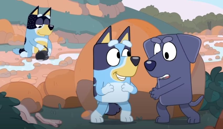 A cartoon dog is talking to another dog in a rocky area.