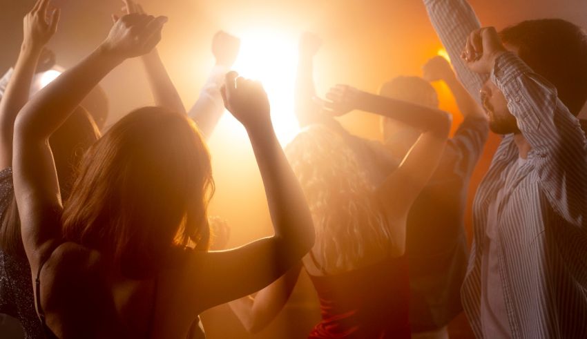 A group of people dancing at a nightclub.