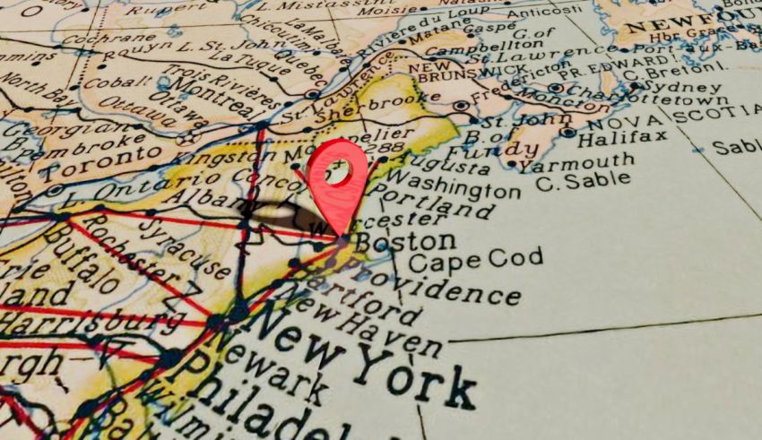 A red pin is pinned on a map of new england.