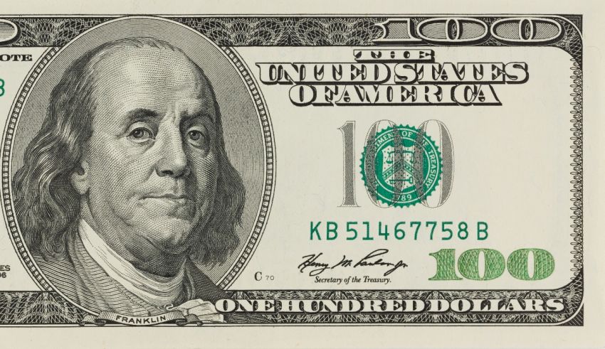 A 100 dollar bill with a portrait of benjamin franklin.