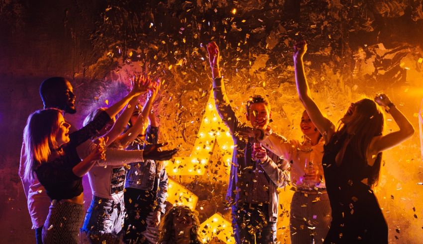 A group of people at a party with confetti.