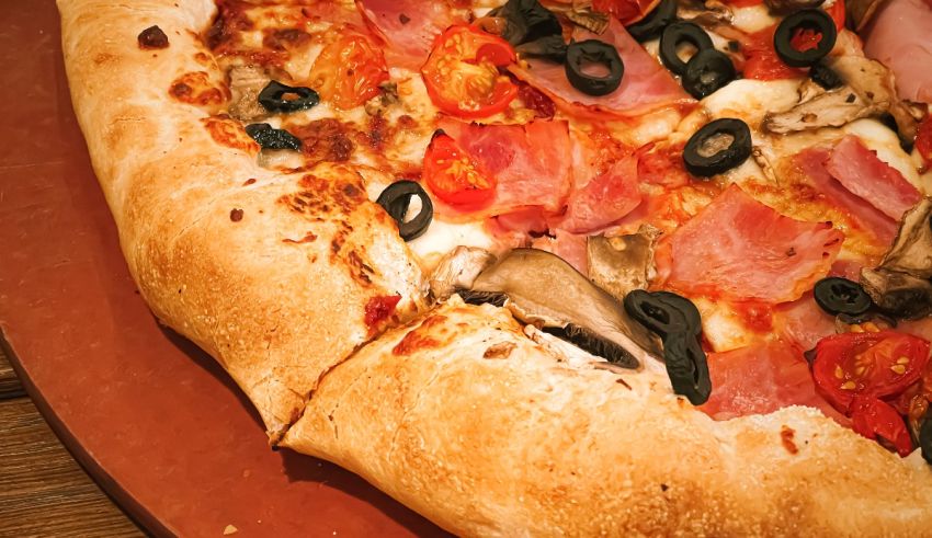 A pizza on a wooden table.