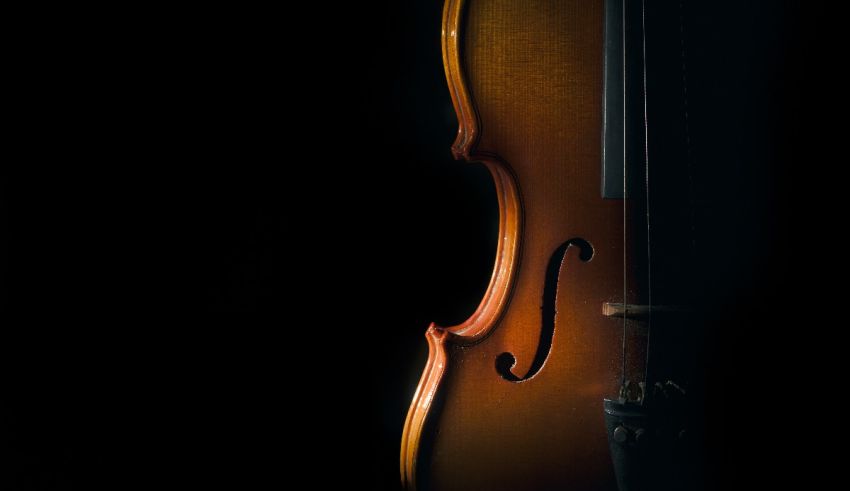An image of a violin against a black background.