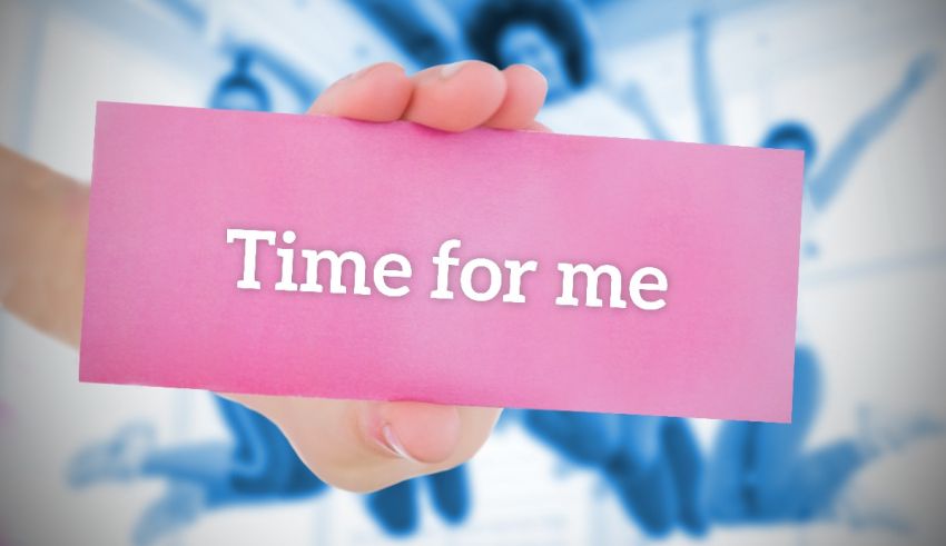 A person holding up a pink card that says time for me.