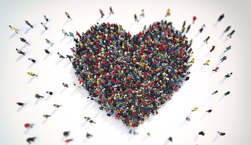 A large group of people in the shape of a heart.