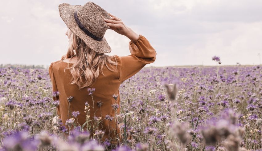 A woman in a hat in a lavender field.