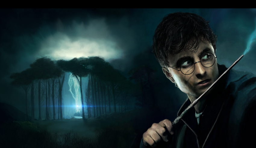 Harry potter with a wand in front of a dark forest.