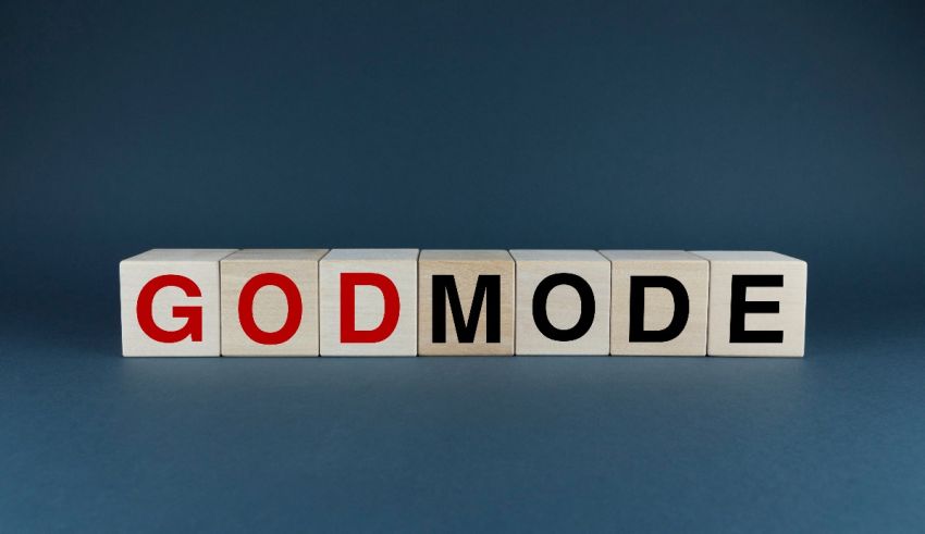 The word godmode spelled out in wooden blocks on a blue background.