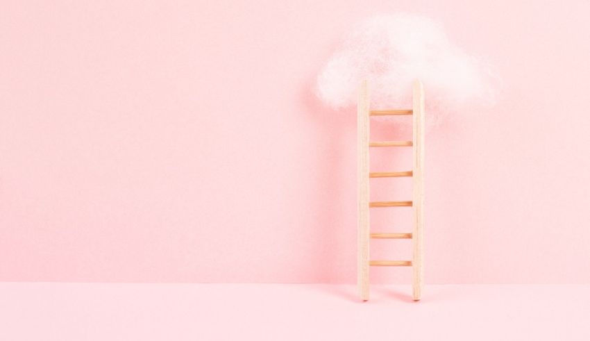 A wooden ladder with a cloud on top of it.