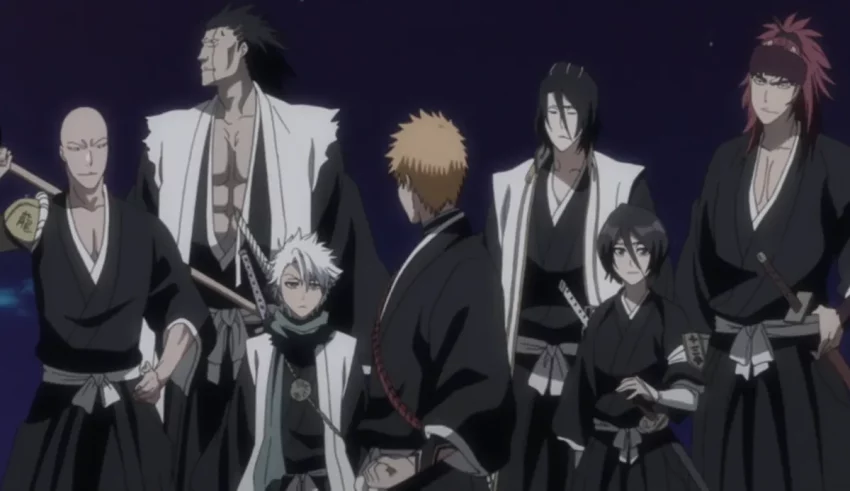 A group of samurai wearing black robes and swords.