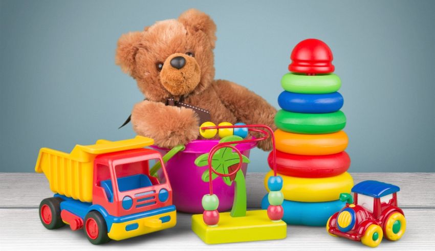 A teddy bear and other toys on a blue background.