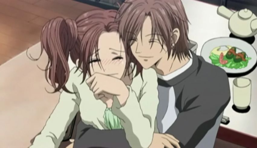 An anime couple hugging in front of a table.