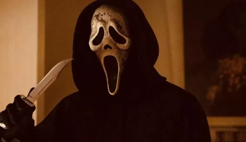 A man with a scream mask holding a knife.