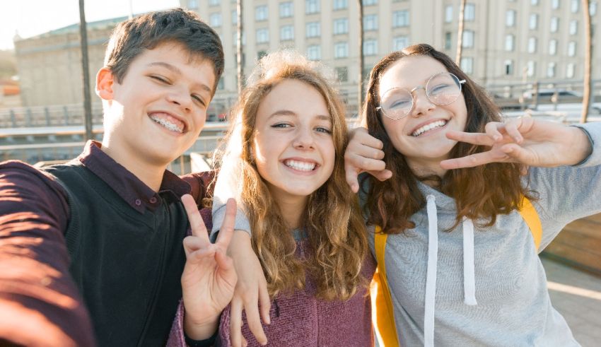 A group of young people taking a selfie.
