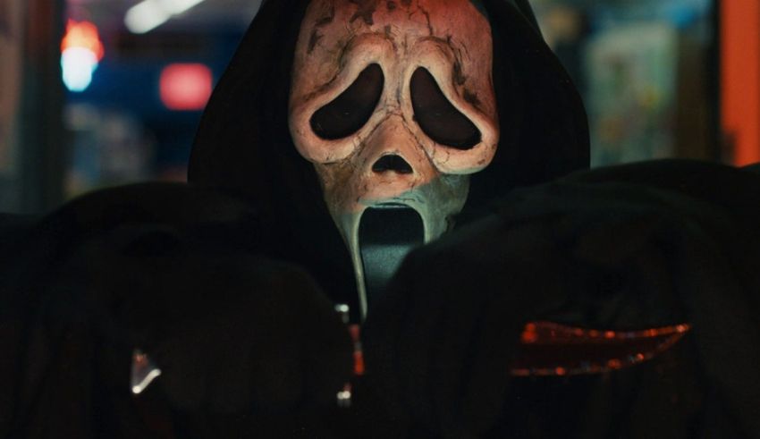 A man with a scream mask holding a knife.
