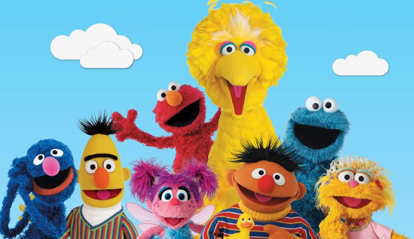 A group of sesame street characters posing for a picture.