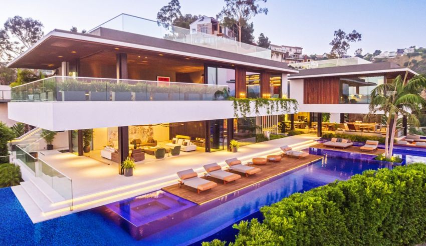 A modern home with a pool and lounge area.