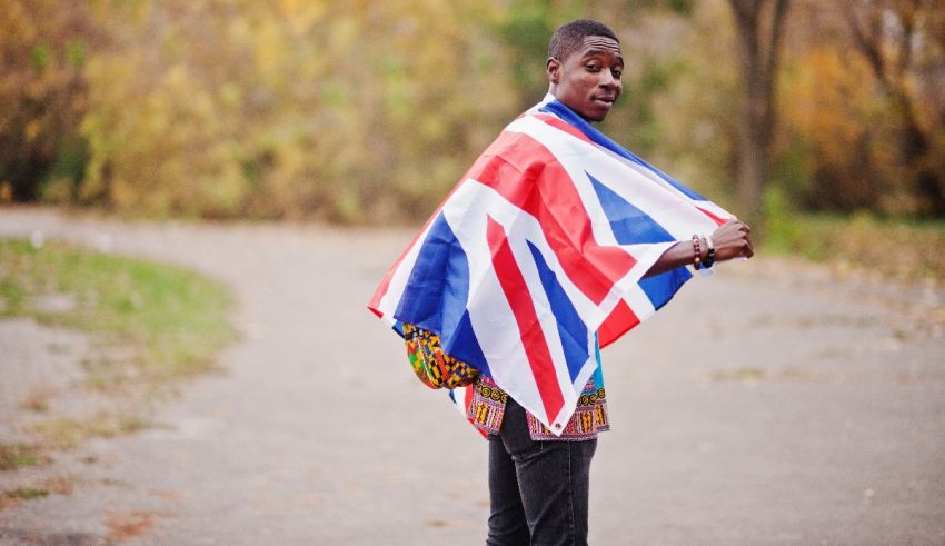 A man with a british flag on his back.