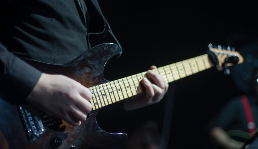 A person is playing an electric guitar.