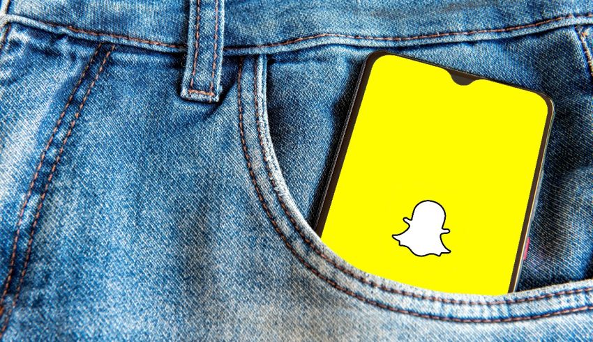 Snapchat in the pocket of a denim jacket.