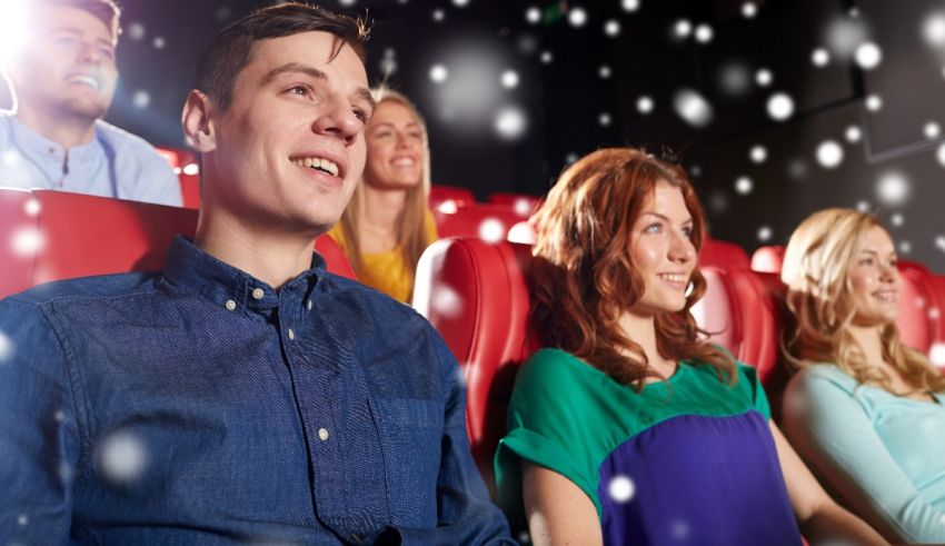 A group of people sitting in a movie theater.