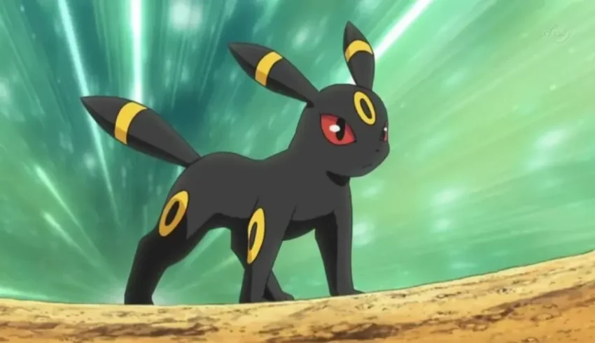 A black and yellow pokemon standing on the ground.