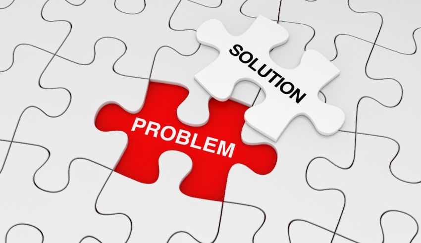 A puzzle piece with the words solution and problem.
