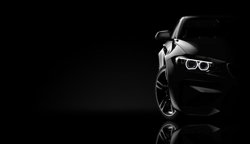 The bmw m4 is shown in a black background.